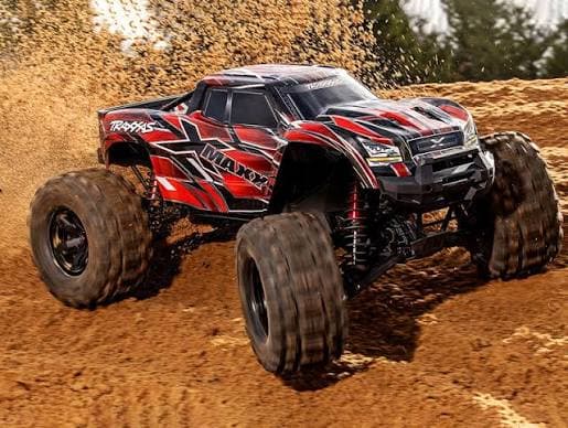 A Traxxas RC monster truck kicking up dirt