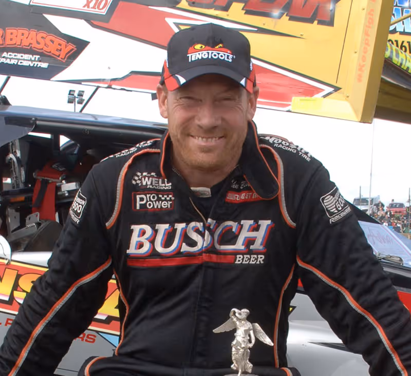 Rob Speak, driver of Big Thunder, holding a trophy