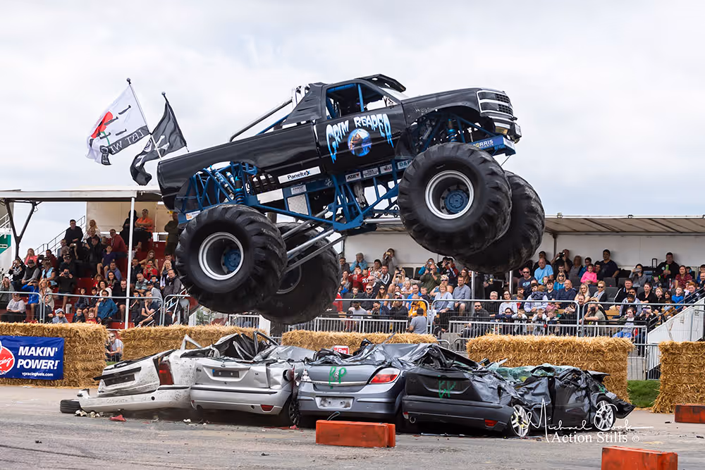 Grim Reaper launching off a line of crushed cars